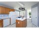 Open kitchen layout with a center island, dining area, and lots of natural light, great for Gathering meals at 213 Yellow Poplar Ave, Wake Forest, NC 27587