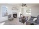 Bright living room features a fireplace, large windows and neutral decor at 213 Yellow Poplar Ave, Wake Forest, NC 27587
