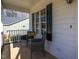 Cozy front porch featuring comfortable seating, ideal for relaxing and enjoying the outdoors at 213 Yellow Poplar Ave, Wake Forest, NC 27587