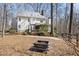 Spacious backyard features a fire pit perfect for outdoor gatherings at 2325 Old Oak Pl, Hillsborough, NC 27278