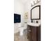 Charming half bathroom features a vanity with updated fixtures at 2325 Old Oak Pl, Hillsborough, NC 27278