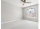 Bright bedroom features neutral carpet, ceiling fan, and a sun-filled window at 2325 Old Oak Pl, Hillsborough, NC 27278