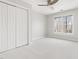 Bedroom features neutral carpet, ceiling fan, and a large closet at 2325 Old Oak Pl, Hillsborough, NC 27278