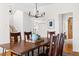 Formal dining room features wood floors, a chandelier, and plenty of space for entertaining at 2325 Old Oak Pl, Hillsborough, NC 27278