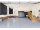 Spacious garage with epoxy floors and custom storage solutions at 2325 Old Oak Pl, Hillsborough, NC 27278