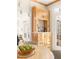 A cozy breakfast nook off the kitchen features natural wood cabinetry and access to the living room at 2325 Old Oak Pl, Hillsborough, NC 27278