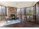 Screened porch boasts a stone fireplace and comfortable seating at 2325 Old Oak Pl, Hillsborough, NC 27278