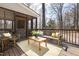 Relaxing screened porch with wood floors offers a serene outdoor retreat at 2325 Old Oak Pl, Hillsborough, NC 27278