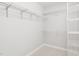 Walk-in closet featuring white walls, carpet, and metal shelving at 2325 Old Oak Pl, Hillsborough, NC 27278