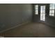 Unfinished bedroom with a window and glass door providing natural light at 247 Meadowbark Bnd # 29, Garner, NC 27529