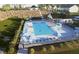 Aerial view of the community pool with lounge chairs and umbrellas at 247 Meadowbark Bnd # 29, Garner, NC 27529