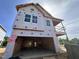 New construction home featuring a two-story layout, visible framing, and house wrap ready for finishing touches at 247 Meadowbark Bnd # 29, Garner, NC 27529
