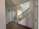 Entryway featuring staircase with black metal railings and light-colored walls at 247 Meadowbark Bnd # 29, Garner, NC 27529