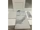 An assortment of neutral-toned tiles and a modern-style cabinet door are laid out at 247 Meadowbark Bnd # 29, Garner, NC 27529