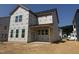 Exterior view of a two-story home under construction with visible windows and covered porch area at 251 Meadowbark Bnd # 30, Garner, NC 27529