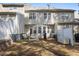 Relaxing backyard with patio seating, a grill, and partial fencing, providing a private retreat at 2822 Casona Way, Raleigh, NC 27616