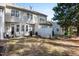 A spacious backyard with patio seating, a grill, lush grass, and privacy fencing at 2822 Casona Way, Raleigh, NC 27616