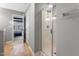 Bathroom with a glass-enclosed shower featuring a showerhead and an open doorway at 2822 Casona Way, Raleigh, NC 27616