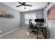 Home office / bedroom featuring a spacious desk, two monitors, rolling chair, and American flag art at 2822 Casona Way, Raleigh, NC 27616