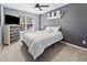 This bedroom offers a ceiling fan, a stylish dresser, and a window for plenty of natural light at 2822 Casona Way, Raleigh, NC 27616