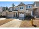 Attractive townhome with brick accents, a single car garage and well-maintained landscaping at 2822 Casona Way, Raleigh, NC 27616