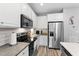 Well-appointed kitchen with stainless steel appliances and modern cabinetry at 2822 Casona Way, Raleigh, NC 27616
