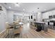 Open-concept kitchen and living area featuring modern appliances and ample counter space at 2822 Casona Way, Raleigh, NC 27616