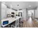 Modern kitchen boasts sleek countertops, stainless appliances, and bar seating at 2822 Casona Way, Raleigh, NC 27616