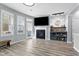 Inviting living room with fireplace, bar, and natural light streaming in at 2822 Casona Way, Raleigh, NC 27616
