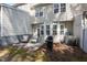 Cozy backyard patio features outdoor seating, a grill, and access to the home's exterior at 2822 Casona Way, Raleigh, NC 27616