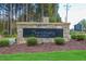 Stone community sign for 'Sanctuary at Lake Wheeler' surrounded by manicured landscaping at 2916 Frances Marie Ln, Raleigh, NC 27603