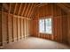 Spacious room under construction featuring a large window and wood framing to create a modern design at 2916 Frances Marie Ln, Raleigh, NC 27603