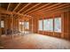 Interior view of a home under construction featuring a series of windows overlooking the outdoor space at 2916 Frances Marie Ln, Raleigh, NC 27603