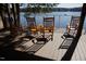 A lakeside deck features rocking chairs with a view of the lake at 2916 Frances Marie Ln, Raleigh, NC 27603