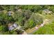 An aerial view of the homes nestled among lush mature trees and showing surrounding neighborhood at 2968 Tram Rd, Fuquay Varina, NC 27526