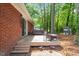 Brick home with a spacious backyard featuring a large deck with plenty of room for outdoor seating at 2968 Tram Rd, Fuquay Varina, NC 27526