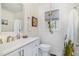 Bright bathroom with white subway tile, modern fixtures, and stylish décor at 2968 Tram Rd, Fuquay Varina, NC 27526