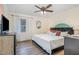Comfortable bedroom with soft lighting, a ceiling fan, and a neutral color palette at 2968 Tram Rd, Fuquay Varina, NC 27526