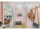 Welcoming hallway with stylish accents, leading to the kitchen and living area at 2968 Tram Rd, Fuquay Varina, NC 27526