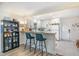 Bright and airy kitchen featuring white cabinets, butcher block counters, and breakfast bar at 2968 Tram Rd, Fuquay Varina, NC 27526
