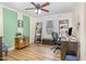 Bright office featuring custom storage, ceiling fan, and large window at 2968 Tram Rd, Fuquay Varina, NC 27526