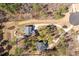 Aerial view of two homes on large wooded lots each with a long drive and a private pond at 298 Bonterra Way, Chapel Hill, NC 27516