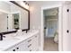 Modern bathroom with a double vanity, black fixtures, and stylish finishes provides a spa-like experience at 298 Bonterra Way, Chapel Hill, NC 27516