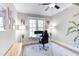 Bright office with modern desk and decor, featuring a large window overlooking a serene outdoor view at 298 Bonterra Way, Chapel Hill, NC 27516