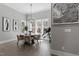 Bright dining room with large windows and modern chandelier at 298 Bonterra Way, Chapel Hill, NC 27516