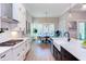 Dining area boasts natural light, a modern chandelier, and views of the surrounding landscape at 298 Bonterra Way, Chapel Hill, NC 27516