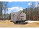 Charming home with light grey facade, and professionally landscaped yard at 298 Bonterra Way, Chapel Hill, NC 27516