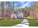 Charming two-story home with a curved driveway and a beautiful, expansive front yard at 298 Bonterra Way, Chapel Hill, NC 27516