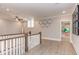 Open hallway offers views to multiple rooms, hardwood floors, and a relaxing atmosphere at 298 Bonterra Way, Chapel Hill, NC 27516