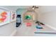 Well-equipped home gym featuring a treadmill, weight bench, workout mats, and a ceiling fan at 298 Bonterra Way, Chapel Hill, NC 27516